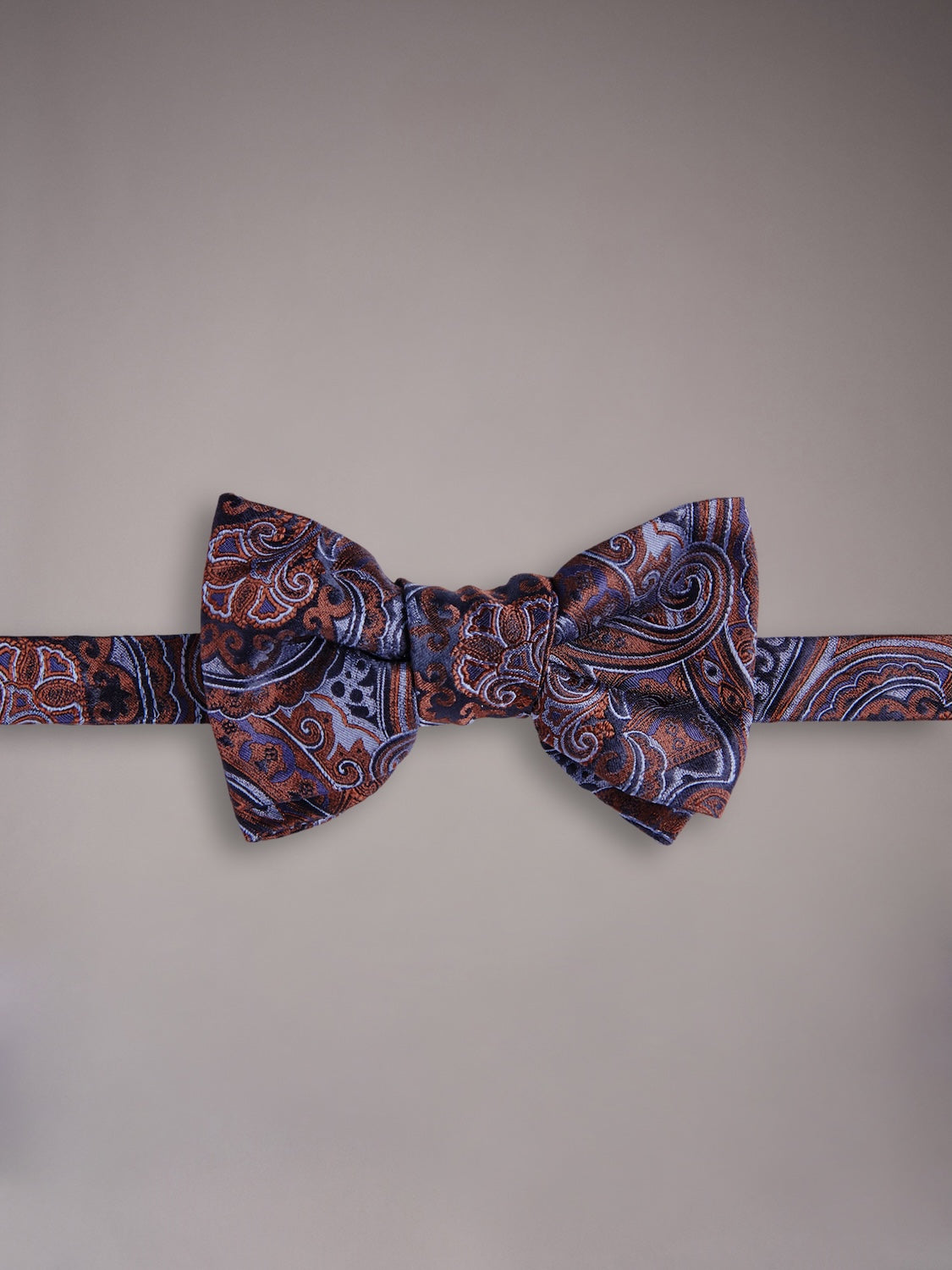 Self-tie bow tie in blue silk with a paisley motif